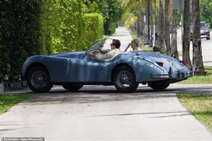Emerging: Newlyweds Brooklyn Beckham and Nicola Peltz were pictured for the first time since $3.5m wedding as they joined his parents David and Victoria for lavish Sunday brunch in matching classic convertibles in Palm Beach
